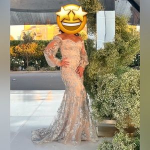 Prom dress. Used size 8. Cream in color with silver overlay sparkle design.